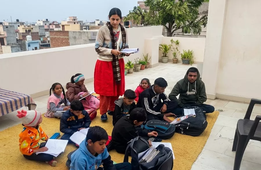 Teacher guiding students during outdoor study time